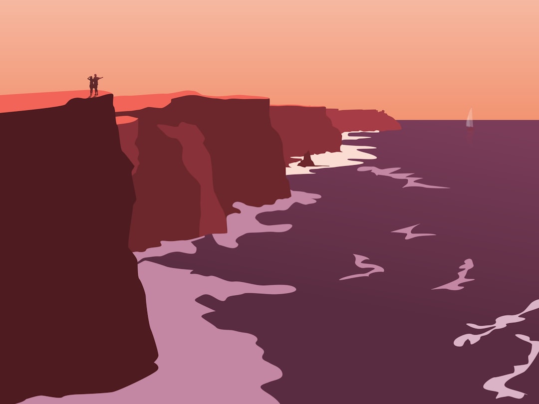 Couple enjoys sunset view from the cliffs.