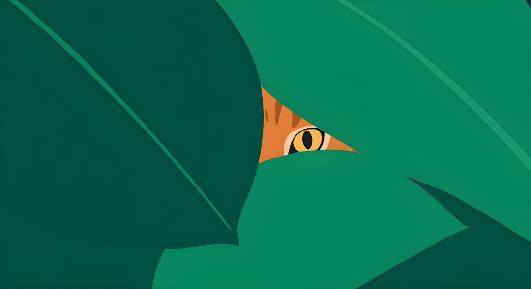 A cat's eye peeking through green leaves